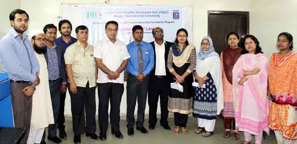 Participants are seen in a photo-pose at the self-assessment peer review programme at Dhaka International University in the city on Tuesday.