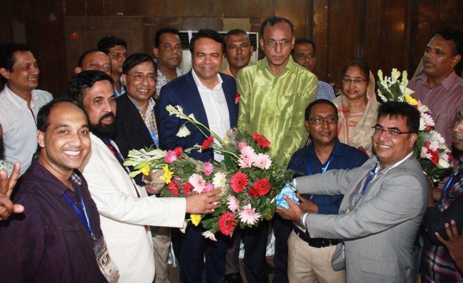 Deputy-Secretary General of Bangladesh Olympic Association Ashiqur Rahman Miku greets the newly elected Executive Committee of Bangladesh Chess Federation at the National Sports Council on Tuesday.