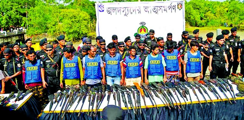 Ten members of infamous robber gang Master Bahini including its ring-leader surrendered along with 52 firearms and 5000 rounds of bullets to RAB in presence of Home Minister Asaduzzaman Khan Kamal (not seen in the picture) at Mongla Jetty in Bagerhat on T