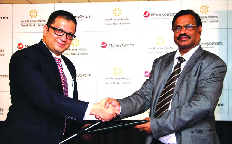 MoneyGram and Sonali Bank signed a deal on money transfer on Wednesday. Sheshagiri Malliah, MoneyGram's Regional Director, South Asia and Abu Bakar Md Noman - DGM Sonali Bank exchange document after signing the deal.