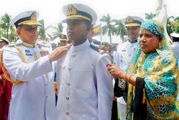 Navy Chief Admiral Nizamuddin Ahmed adgjudging a rank badge to a new officer who got Commission on Wednesday.