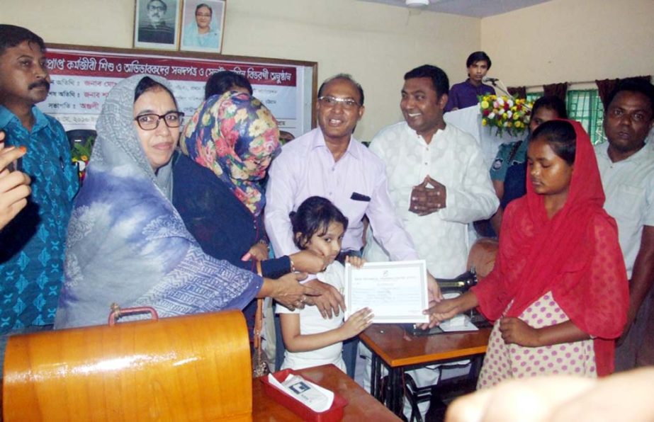 Kazi Mohammad Saifual Alam, Chief Executive Officer, CCC distributing certificates among the technical trainees of working children organised by World Vision on Tuesday.