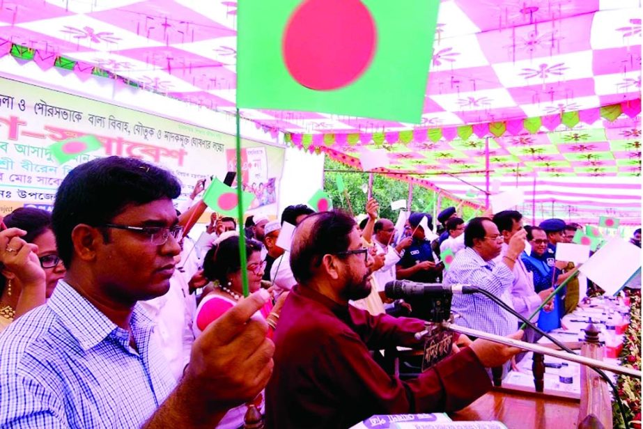 NILPHMARI: Cultural Affairs Minister Asaduzzaman Noor MP speaking at a mass gathering declaring the district free from child marriage, dowry and drug at Nilphamari Boro field premises as Chief Guest recently.