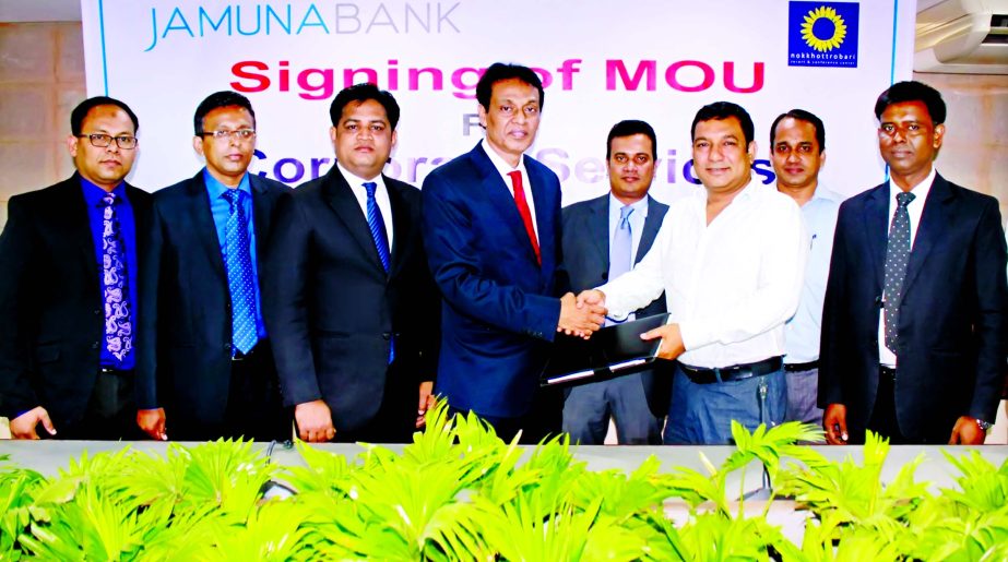 Deputy Managing Director of Jamuna Bank Limited A. K. M. Saifuddin Ahamed and Managing Director of Nokkhottrobari Ltd Tauquir Ahmed sign an agreement at bank's head office recently. Under this agreement, employees of the Bank, Debit & Credit Card holder