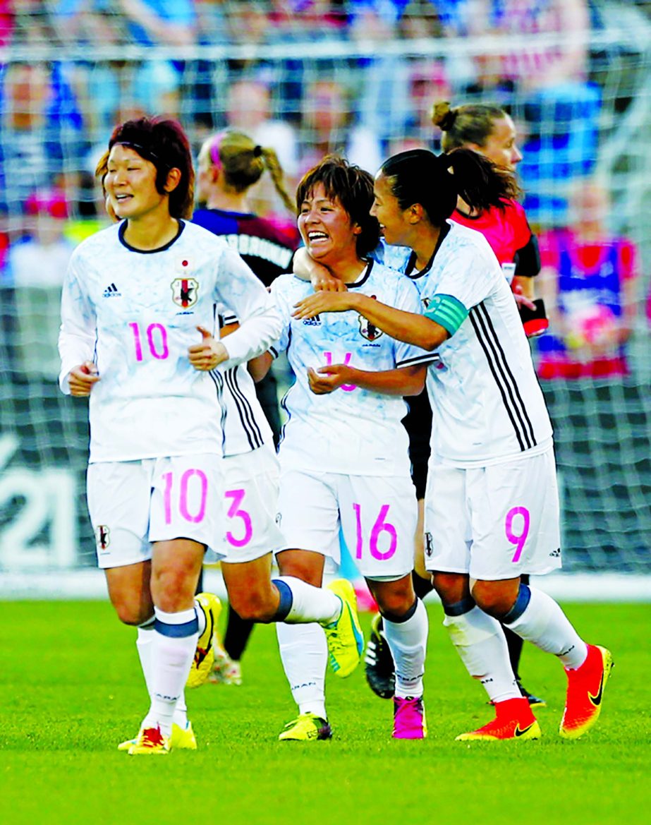 Japan forward Mana Iwabuchi (16) is congratulated by teammate Yuki Ogimi (9) after scoring a goal against the United States during the first half of an International friendly soccer match in Commerce City, Colo on Thursday.