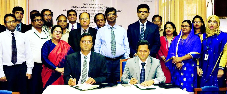 Uttara Bank Limited (UBL) signs a deal with the central bank on 'Refinance Scheme for Agro-based Industries in Rural Areas'' recently in the city. Mohammed Rabiul Hossain, Managing Director & CEO of UBL and Swapan Kumar Roy General Manager of Banglades