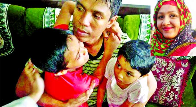 Shocked Chittagong Police Super Babul Akhtar consoling his two sons after their mother Mahmuda Khanom's (inset) killing by the militants on Sunday.