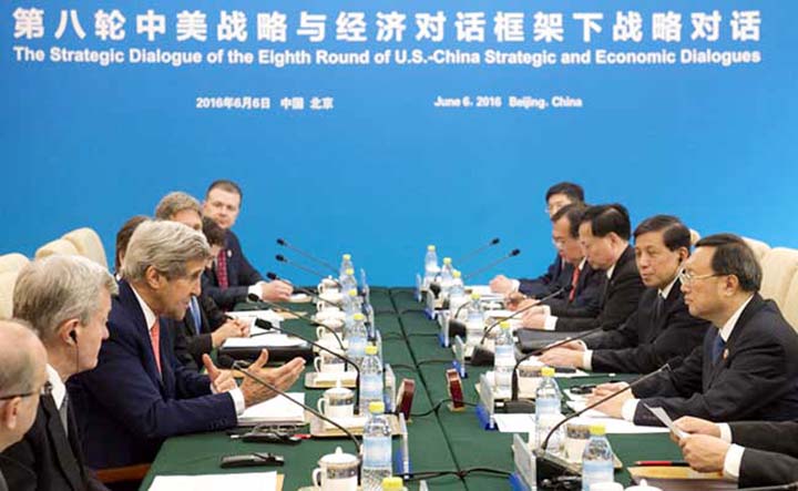 US Secretary of State John Kerry (L) speaks during a session on across from Chinese State Councillor Yang Jiechi (R) as part of the US - China Strategic and Economic Dialogues in Beijing.