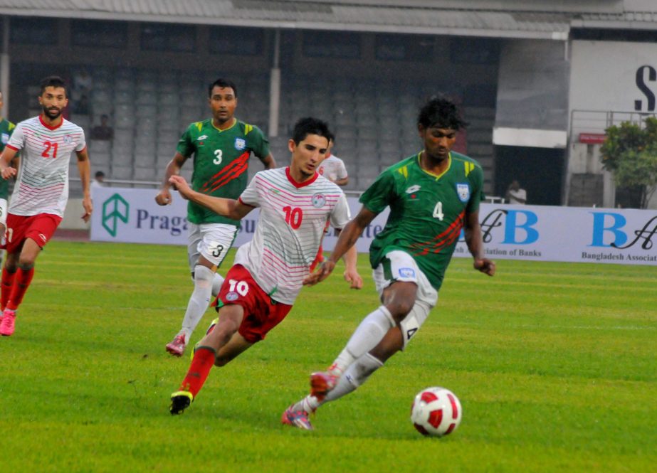An action from the football match of the AFC Asian Cup Qualifiers between Tajikistan and Bangladesh at the Bangabandhu National Stadium on Tuesday.
