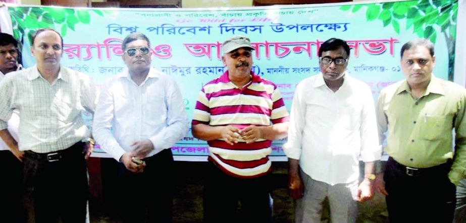 MANIKGANJ: Participants at a discussion meeting on the occasion of the World Environment Day organised by Shibalaya Upazila Administration on Sunday.