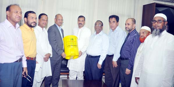 Ajhaj Abdus Samad Lavu, Chairman Al-Arafah Islami Bank Ltd and Vice Chairman, S Alam Group and Md Abdus Salam, MD, Mir Group giving 10 thousand garbage cans to CCC Mayor A J M Nasir Uddin at his office on Tuesday.