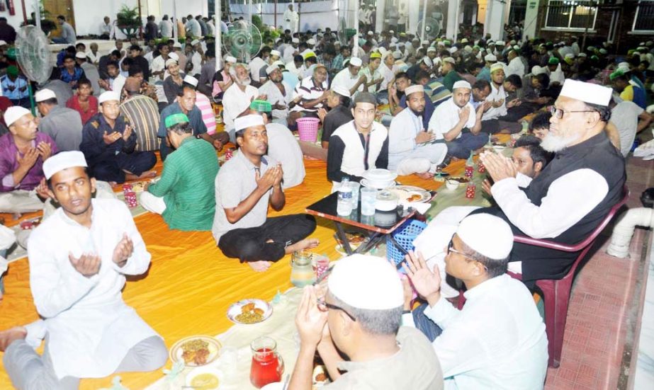 Participants offering Munajat at Premier University campus marking the month- long Iftar Mahfil on the first day of Ramzan on Tuesday.