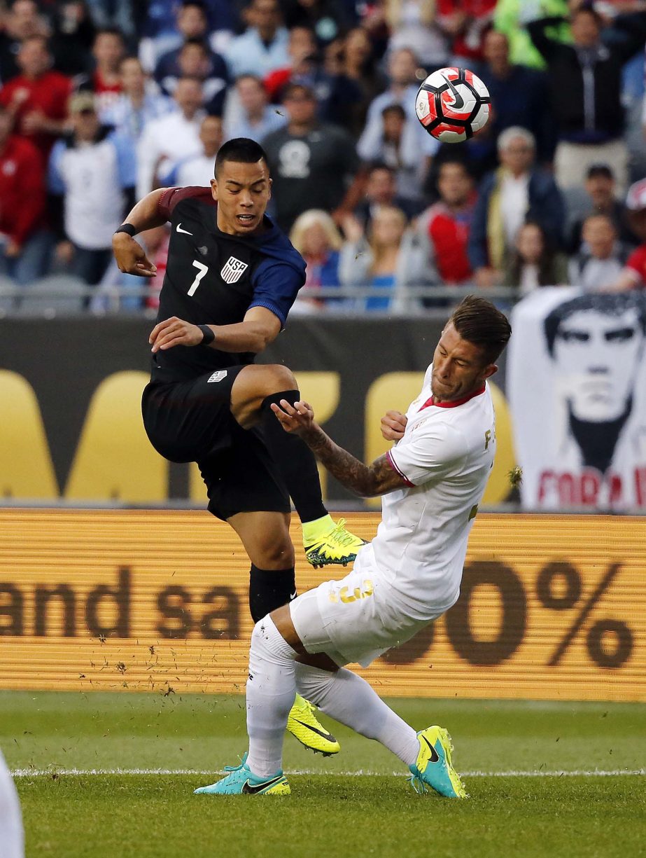United States' Bobby Wood (7) battles Costa Rica's Fancisco Calvo (3) during a Copa America Centenario Group A soccer match at Soldier Field in Chicago on Tuesday.