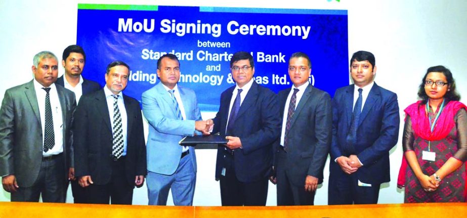 F. R. Khan, Managing Director, bti and Makam E Mahmud Billah, Head Retail Products & Segments, SCB, Bangladesh exchanging document after signing a MoU. Other senior officials of both the organizations were also present at the programme.