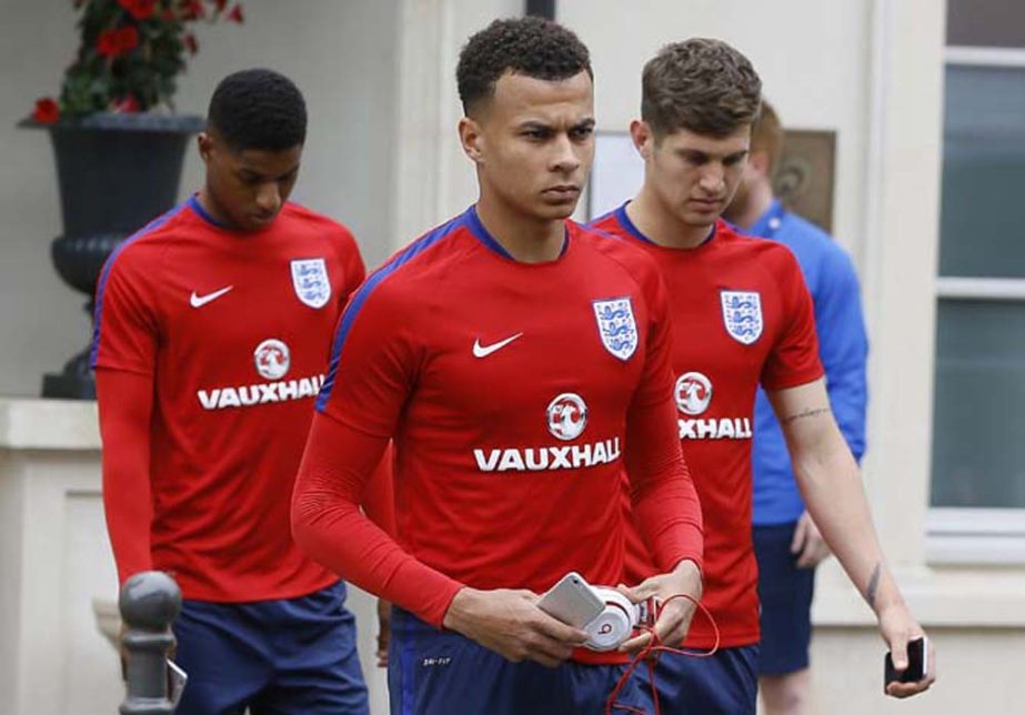 Englandâ€™s Dele Alli , centre, leaves the team hotel in Chantilly, France on Thursday. England will face Russia in a Euro 2016 Group B soccer match in Marseille tomorrow (Saturday).