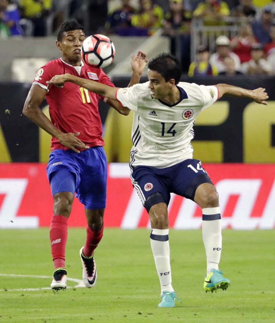 Costa Rica's Johan Venegas (11) works to keep the ball from Colombia's Felipe Aguilar (14) during a Copa America Centenario group A soccer match in Houston on Saturday.