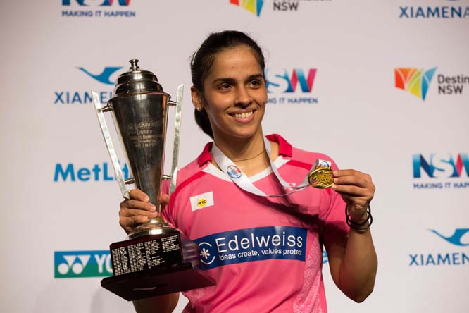 In this photo released by China's Xinhua News Agency, Saina Nehwal of India poses during the awarding ceremony after women's singles final match at Australian Badminton Open 2016 in Sydney, Australia on Sunday. Nehwal defeated China's Sun Yu and claime