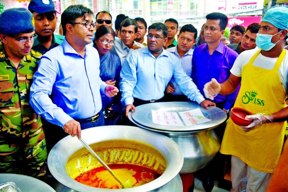 Dhaka South City Corporation Mayor Mohammad Sayeed Khokon at an anti-adulteration drive at iftari shops in the city's Baily Road on Monday.