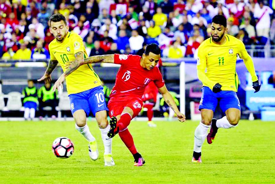 Brazil's Lucas Lima (10) and Peru's Yoshimar Yotun (19) fight for the ball as Brazil's Gabriel (11) gives chase in the second half of a Copa America Group B soccer match between Brazil and Peru in Foxborough, Mass on Sunday.