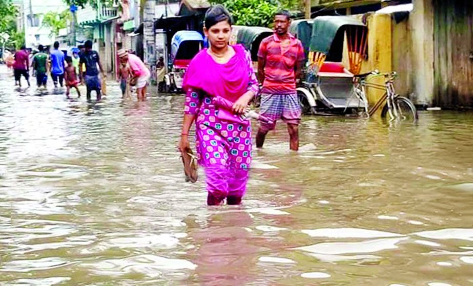 Low-lying areas of Khulna City inundated due to torrential rains causing sufferings to dwellers and commuters for a few days. This photo was taken on Monday.