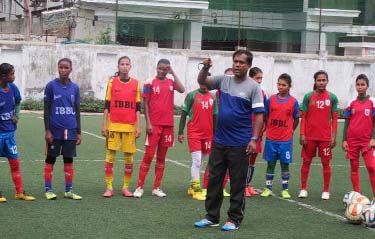 Golam Rabbani Choton giving instructions to the members of Bangladesh Under-16 National Women's Football team during their practice session at the BFF Artificial Turf on Tuesday.
