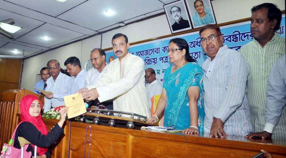 CCC Mayor A J M Nasir Uddin distributing allowance books and ID cards among disabled people at KB Auditorium as Chief Guest on Monday.