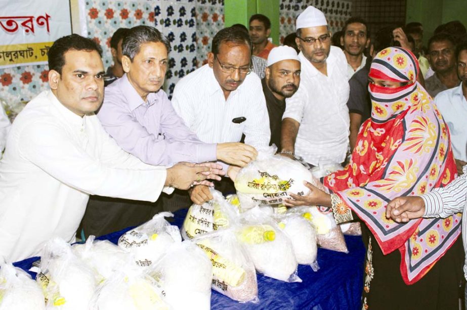 Abdus Salam, Chairman, CDA distributing Ifatr items among the disabled people organised by Mabia Rashidia Foundation recently.