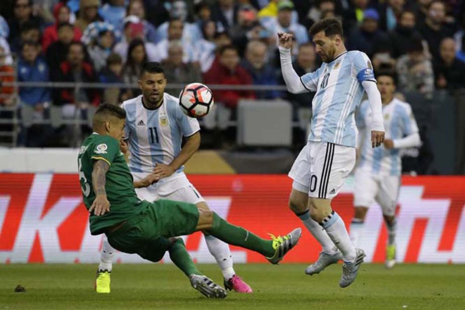 Bolivia's Nelson Cabrera, left, clears the ball under pressure by Argentina's Lionel Messi, right, during a Copa America Centenario Group D soccer match at CenturyLink Field in Seattle on Tuesday.