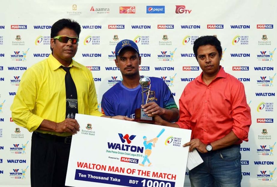 Pawan Negi (C) poses with his Man of the Match award at Khan Saheb Osman Ali Stadium in Fatullah on Wednesday.