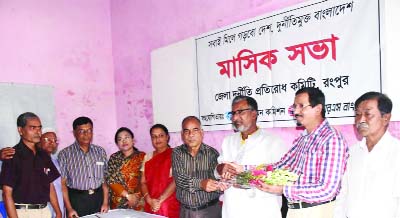 RANGPUR: Newly -appointed Deputy Director of District Combined Office of ACC Mozahar Ali Sarder being greeted at a monthly meeting of District Prevention Committee in Rangpur on Wednesday.