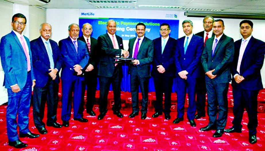 MetLife Bangladesh signed Electronic Payments Solution (EPS) deal with Standard Chartered Bank (SCB) recently. Md. Nurul Islam, Regional Senior Vice President and Head of Bangladesh, Nepal and Myanmar - MetLife and Abrar A. Anwar, Chief Executive Officer