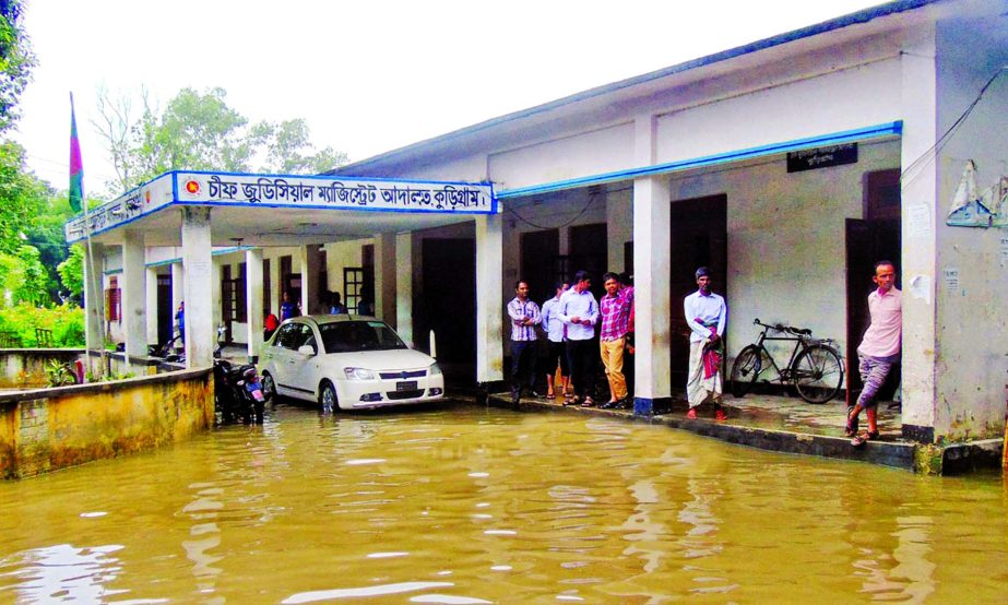 Chief Judicial Magistrate Court and other govt offices were submerged under ankle deep rain water in Kurigram. This photo was taken on Thursday.