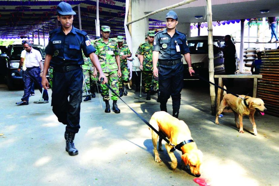 Law-enforcers with dog squad scanning the venue of Jatiya Press Club on Friday ahead of Prime Minister Sheikh Hasina's arrival at the club to join Iftar party today.