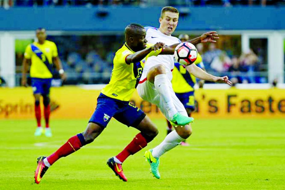 United States' Matt Besler (right) and Ecuador's Enner Valencia fight for the ball during a Copa America Centenario quarterfinal soccer match at CenturyLink Field in Seattle on Thursday. The US won the match 2-1.