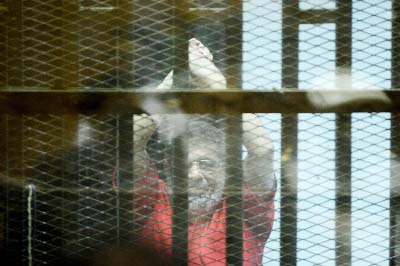 Ousted Egyptian President Mohamed Morsi looks on during a trial session on charges of espionage in Cairo, Egypt on Saturday.