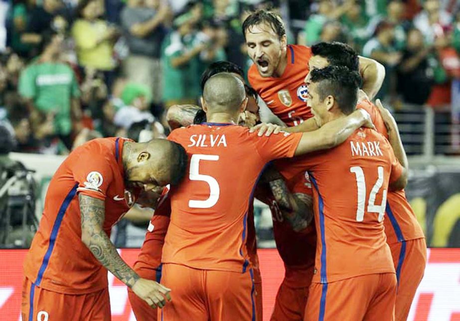 Chile players celebrate after midfielder Edson Puch scored against Mexico during the second half of a Copa America Centenario quarterfinal soccer match at Levi's Stadium in Santa Clara, Calif. on Saturday. Chile won 7-0.