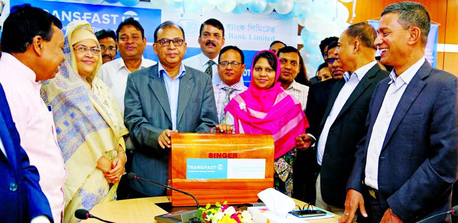 Md Abdus Salam, Managing Director of Janata Bank Limited, handing over a sweing machine to the winners of 'Eid Carnival' promotional programs at JBL Bhaban recently. Hasan Iqbal, Afroza Gul Nahar, Md. Golam Faruque and Md. Abdus Salam Azad, DMDs of the