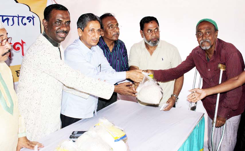 CDA Chairman Abdus Salam distributing Iftar items on behalf of Mabia Rashidia Foundation yesterday.