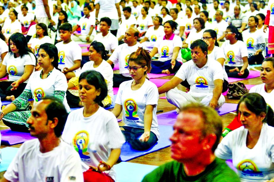 Marking the 'International Yoga Day', people from all walks of life took part at a programme held at Mirpur Indoor Stadium on Tuesday.