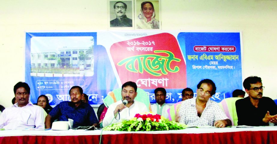 TRISHAL (Mymensingh): A B M Anisuzzaman, Mayor Trishal Pourashva announcing budget of 2016-17 fiscal year at a programme in Trishal on Sunday.