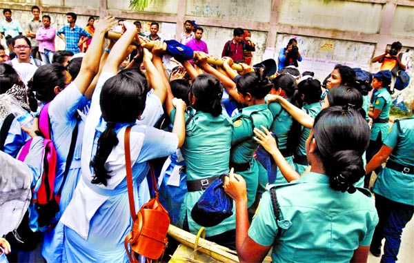 Students of Viqarunnisa Noon School and College blocked the road in front of the college gate on various demands including time change of day shift as they were involved in scuffle with police on Wednesday.