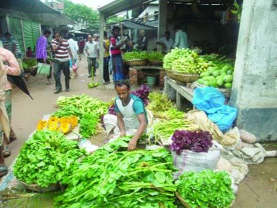 JHENAIDAH : A vegetable vendor with his shop at Sailkupa Bazar in Jhenaidah.