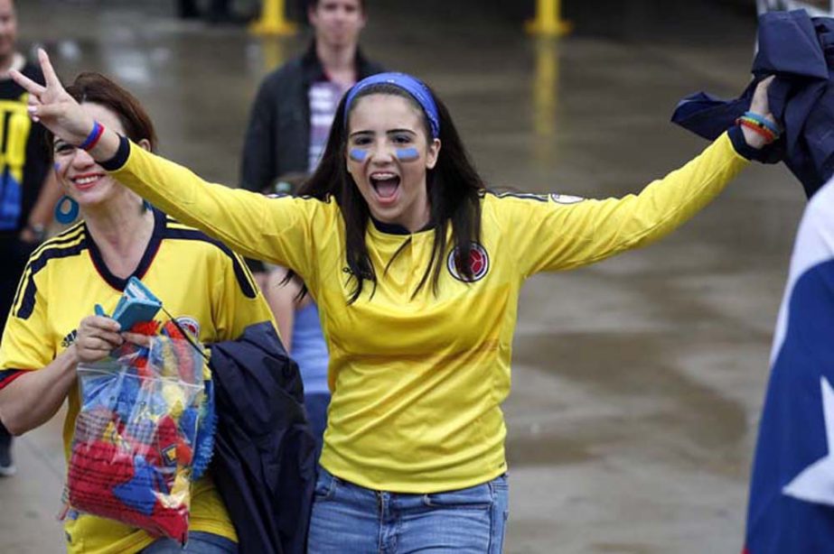 A Colombia fan cheers before a Copa America semifinal soccer match between Colombia and Chile at Soldier Field in Chicago, Wednesday, June 22, 2016.