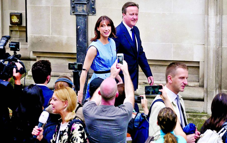 British Prime Minister David Cameron and his wife Samantha leave after casting their votes in the EU referendum at a polling station in London.