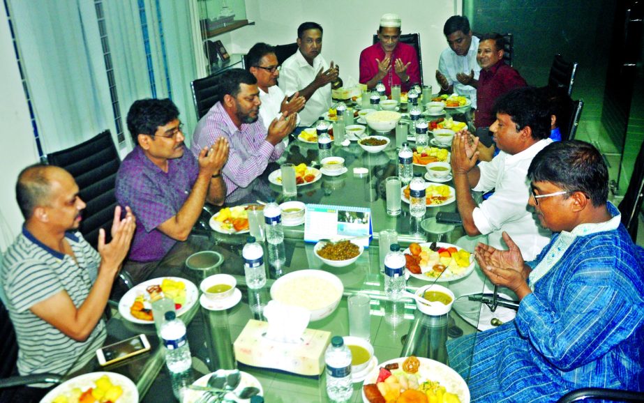 Participants offering Munajat at an Iftar Mahfil organised by Radiant Shipyard Limited at its office in the city on Friday.