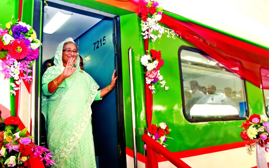 Prime Minister Sheikh Hasina waving the people from inside the train after inauguration of inter-city express train 'Sonar Bangla Express' on Dhaka-Chittagong route at Kamalapur Railway Station on Saturday.