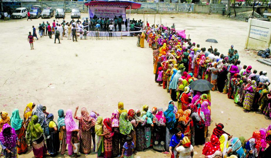 DMP Commissioner Asaduzzaman Miah distributing Zakat clothes among the poor people in city's Dholaipar on Sunday.