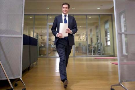 Britain's Chancellor of the Exchequer George Osborne arrives for a news conference in central London on Monday.