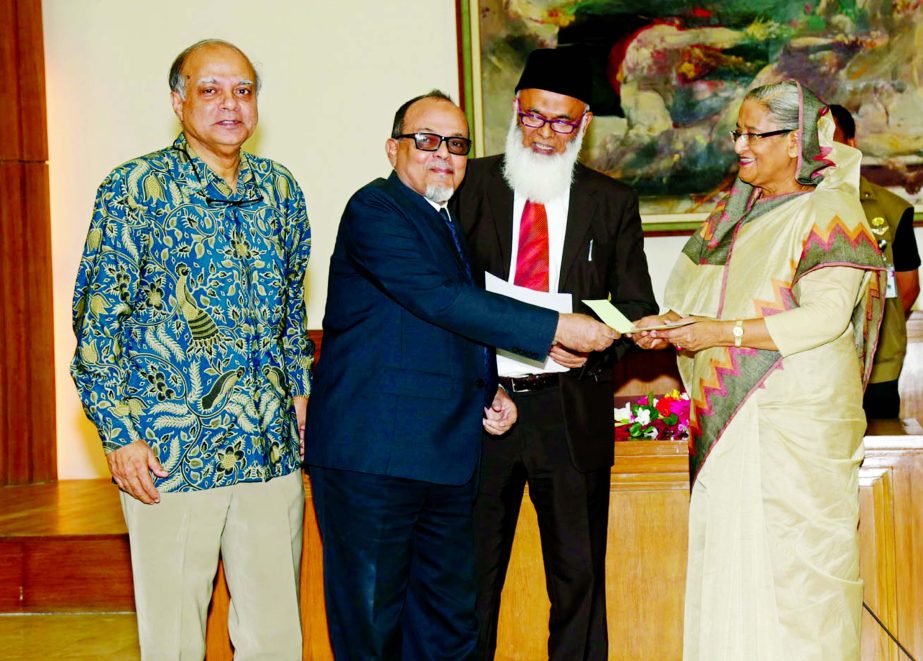 Prime Minister Sheikh Hasina, receiving a cheque of Tk 2 crore from Engr. Mustafa Anwar, Chairman of Islami Bank for Prime Minister's Relief Fund at her office on Monday. Nazrul Islam Majumdar, Chairman, Bangladesh Association of Banks and Professor Dr Q