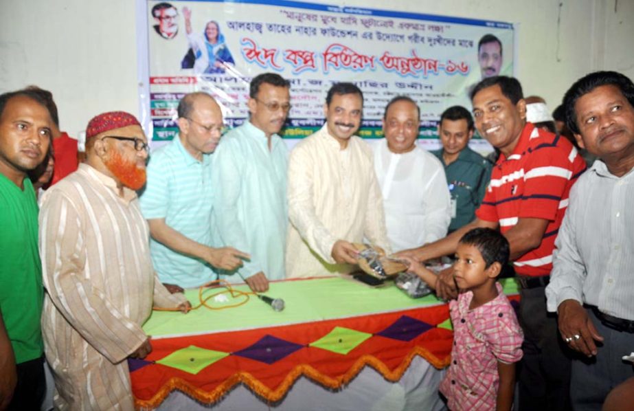 CCC Mayor A J M Nasir Uddin distributing Eid clothes among the poor children organised by Alhaj Taher Nahr Foundation yesterday.